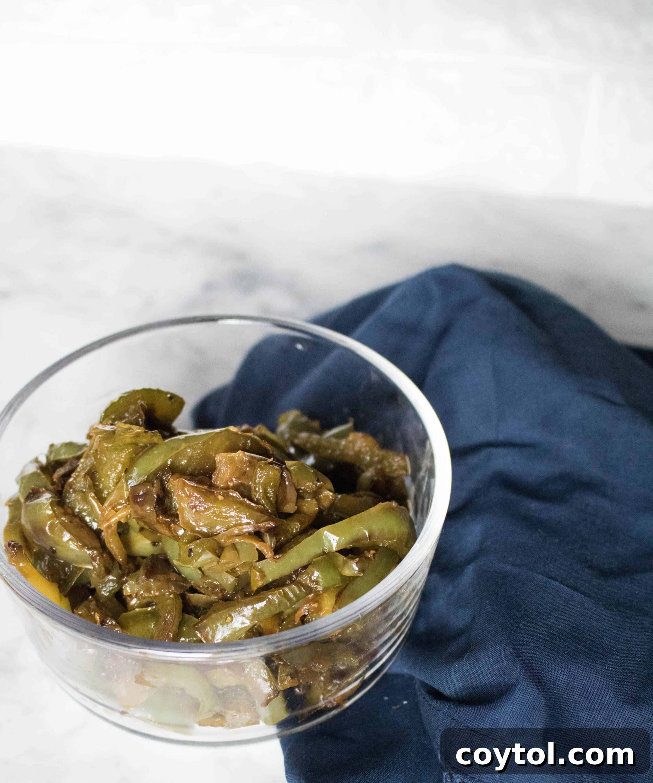 Close-up of golden brown caramelized bell peppers in a pan