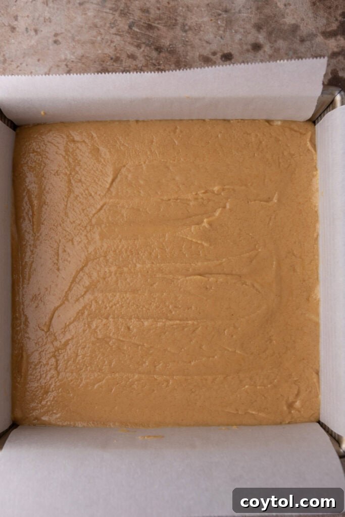Instant Microwave Peanut Butter Fudge 8 The smooth, mixed fudge mixture cooling in a pan, ready for refrigeration.