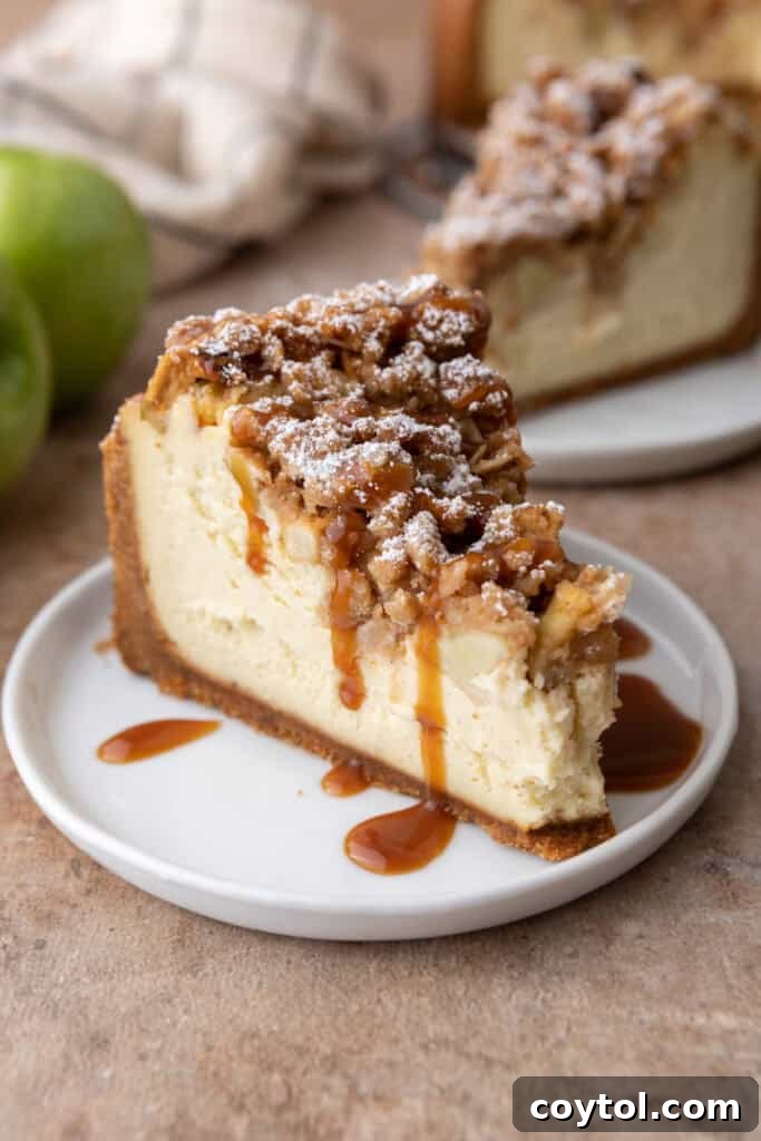 apple crisp cheesecake recipe slice with caramel on top