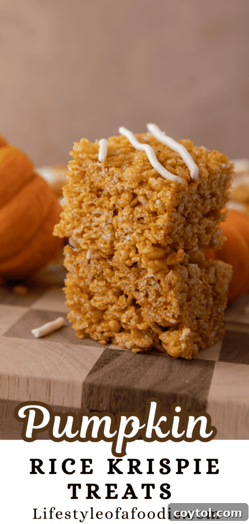 Autumn Pumpkin Rice Krispie Perfection 16 Pumpkin Rice Krispie Treats with a rustic fall background.