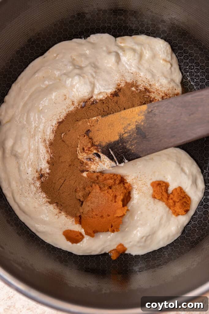 Autumn Pumpkin Rice Krispie Perfection 6 Melted marshmallows and butter in a pot before adding other ingredients.