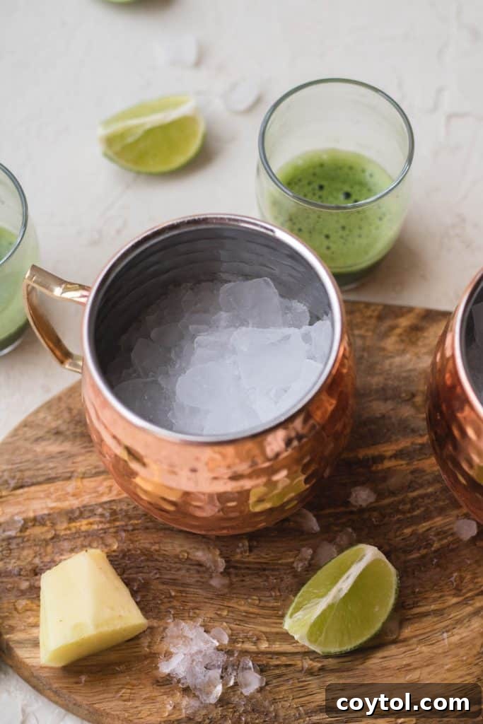 Squeezing fresh lime juice into a copper Moscow Mule mug