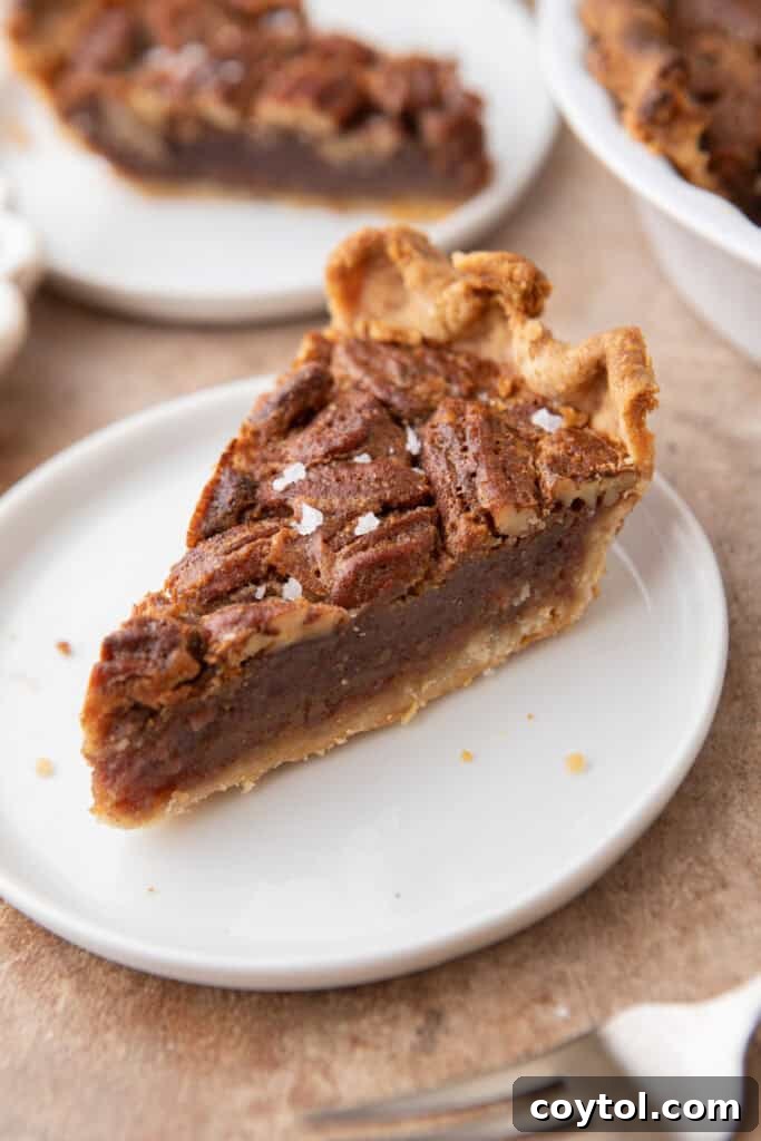 slice of the maple pecan pie on a plate