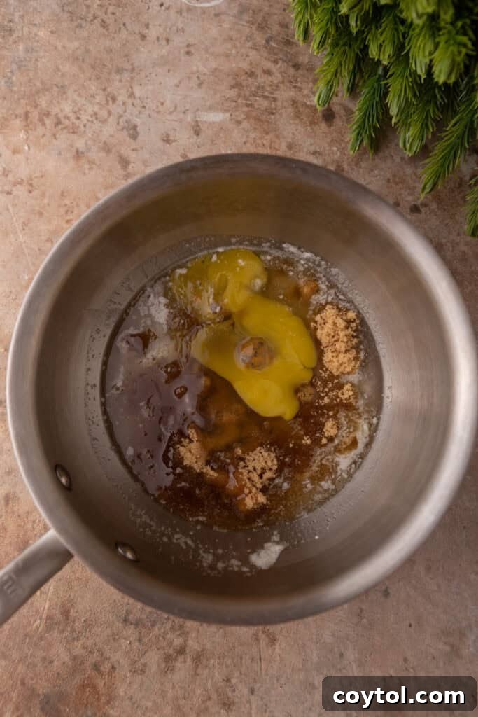 Unmixed ingredients for the pecan pie topping in a saucepan.