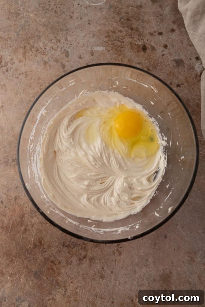 Smooth, creamy cheesecake batter after mixing, ready for pouring.