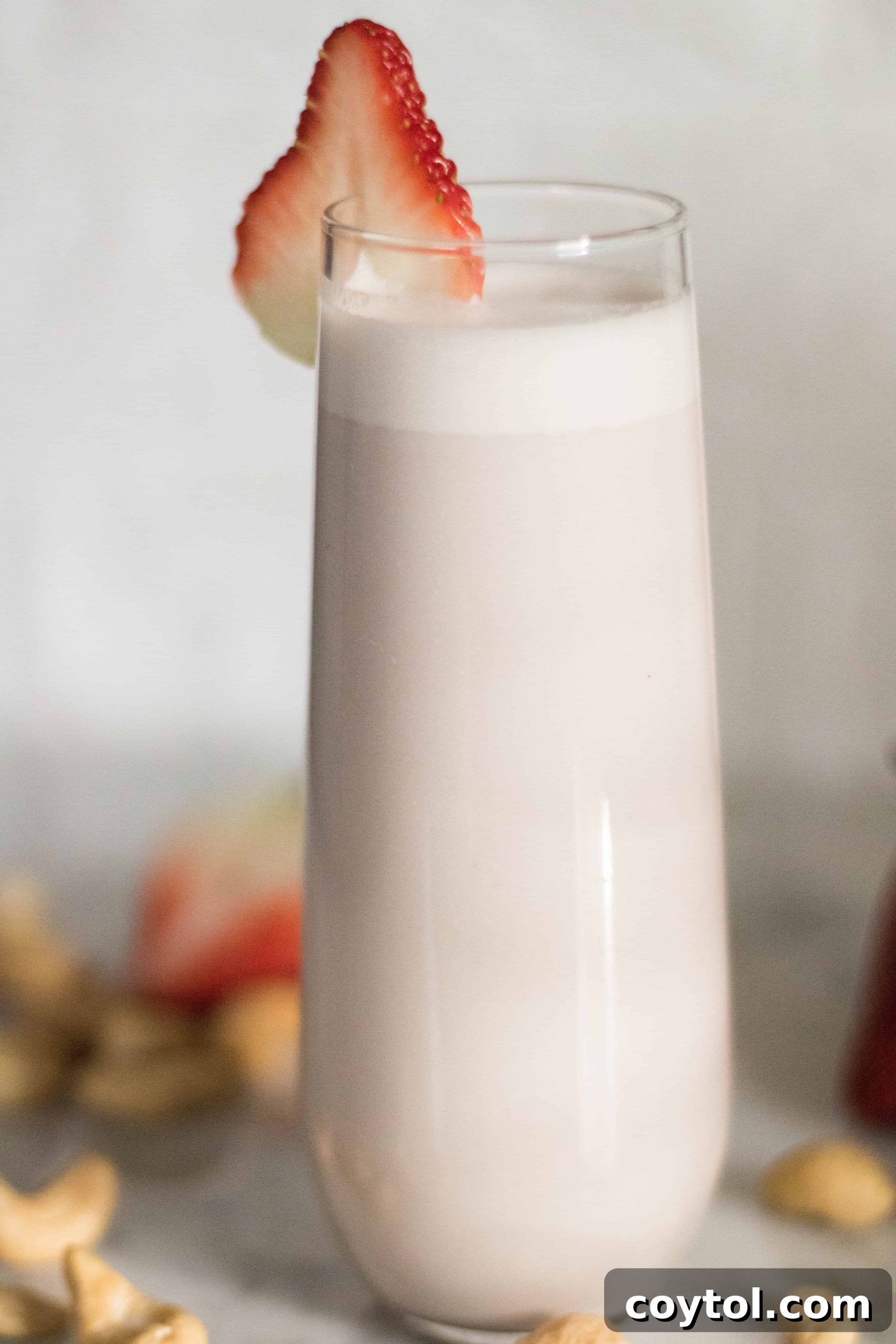 Fresh strawberries and raw cashews, key ingredients for homemade dairy-free strawberry milk
