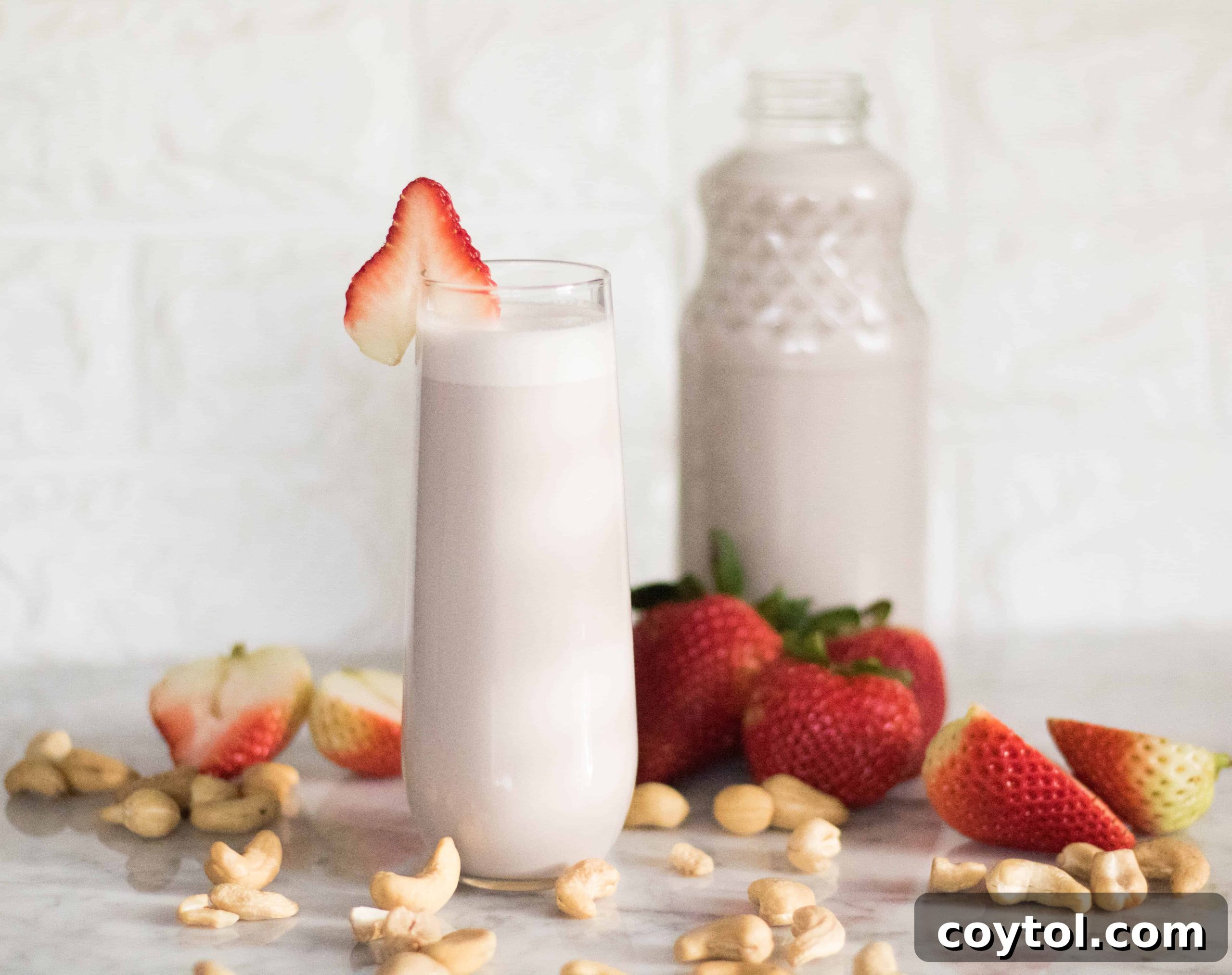 Vibrant pink strawberry cashew milk, a healthy and delicious dairy-free beverage