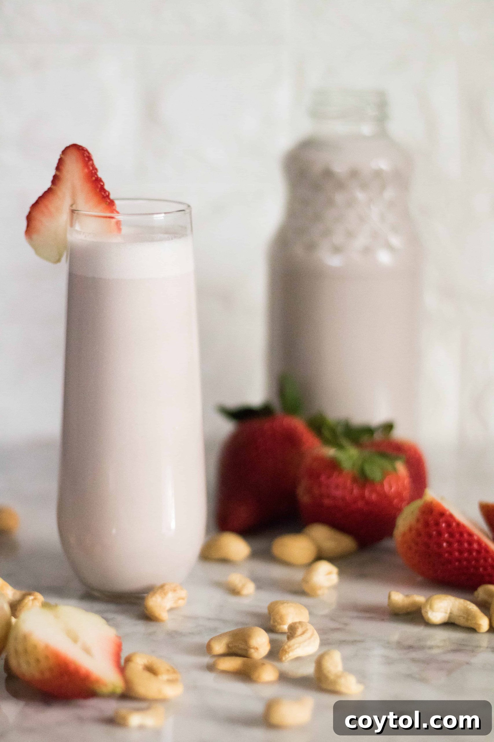 Strawberry cashew milk ready to be served in a glass