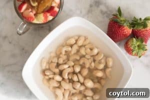 Soaked cashews and prepared strawberries and dates