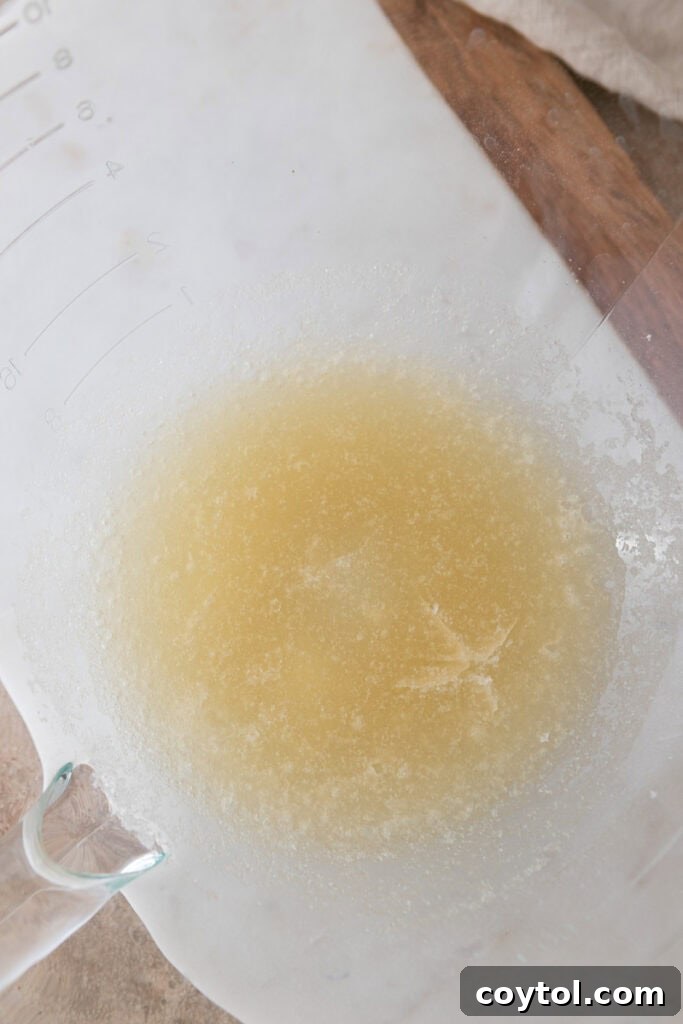 gelatin and water blooming in a stand mixer bowl
