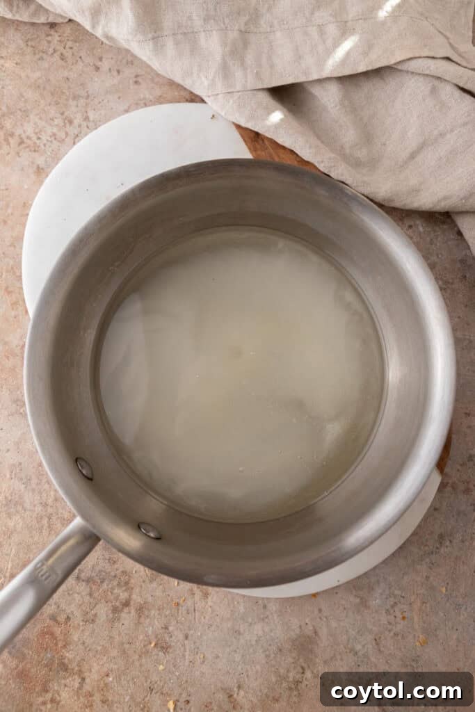 sugar and water heating in a pot for syrup