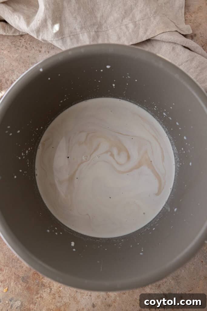 Milk and cream mixture in a slow cooker.
