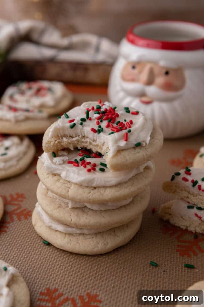 Pillowy Old-Fashioned Sour Cream Sugar Cookies 13 Christmas sour cream sugar cookies with white frosting and red and green sprinkles