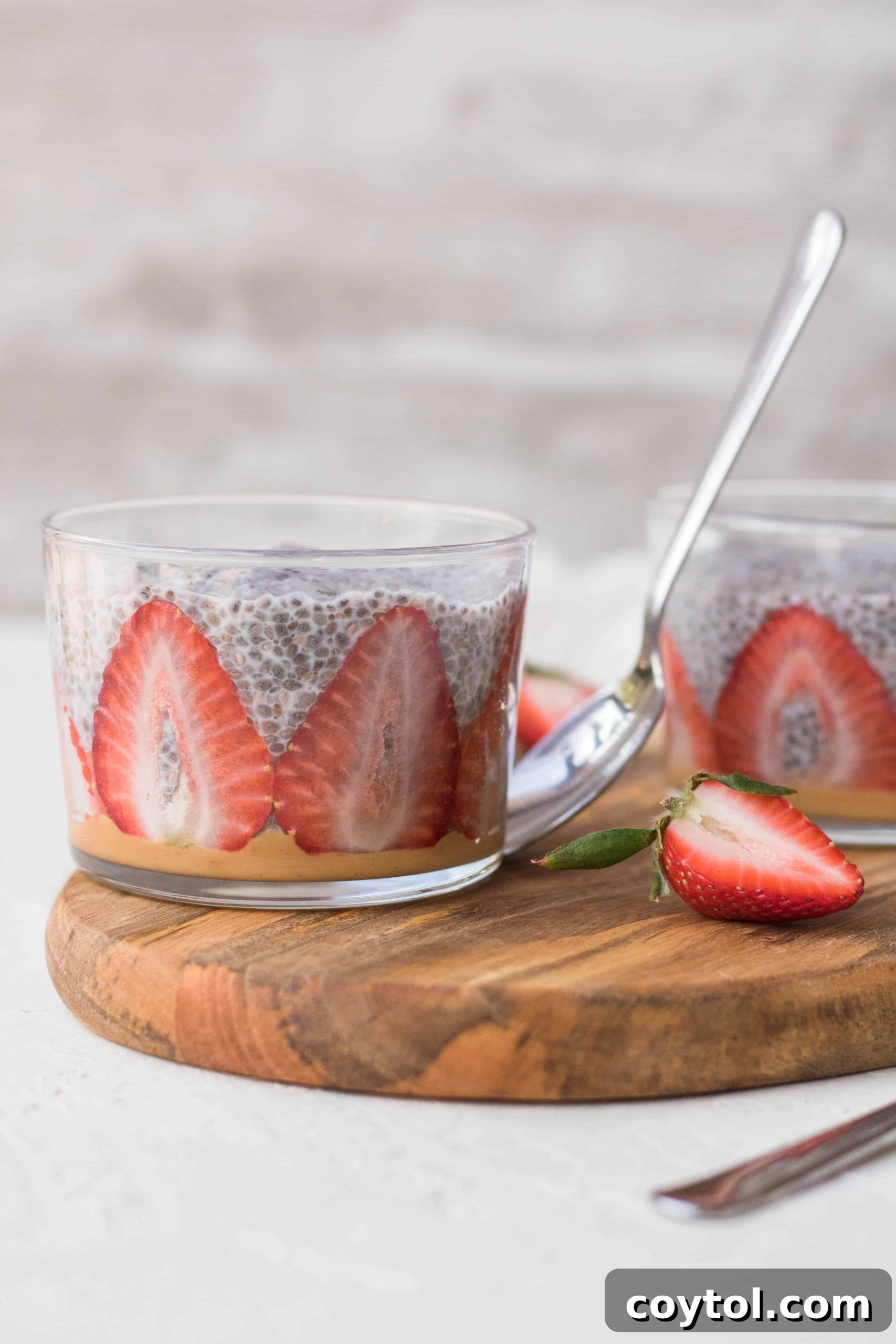 Strawberry Peanut Butter Chia Dream 7 A refreshing glass of strawberry chia seed pudding, layered with fresh fruit and ready for a healthy meal.