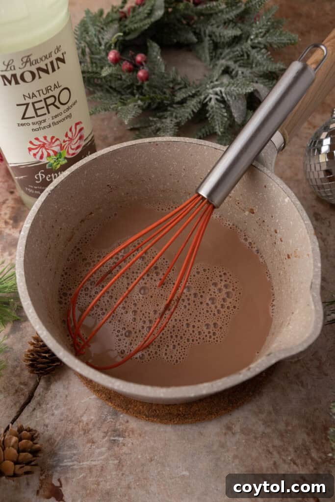 Homemade Peppermint Mocha Creamer: Your Cozy Coffee Upgrade 7 Whisk in a pot full of creamer