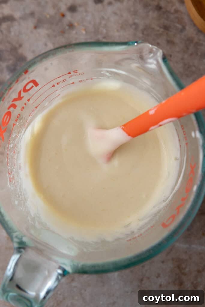 Mixed sourdough discard cracker ingredients in a bowl