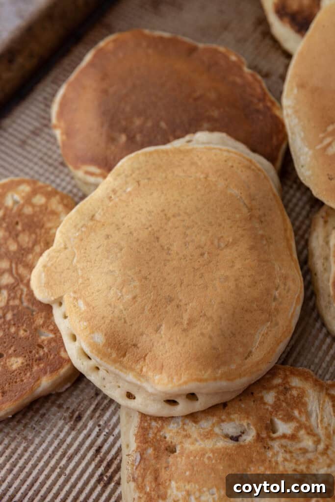 A stack of perfectly golden-brown Sourdough discard Pancakes ready to be served.