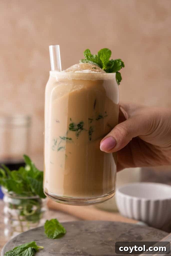 hand holding cup of coffee
