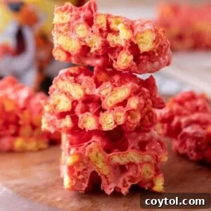 Hot Cheetos Marshmallow Crispy Treats recipe stacked on each other