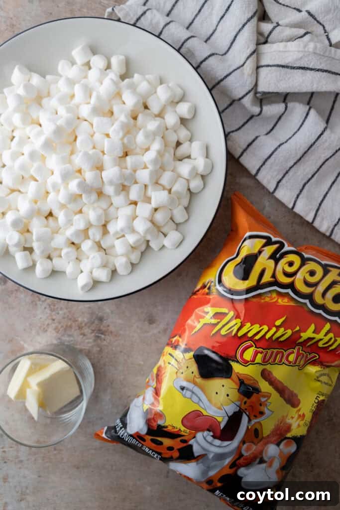 Ingredients for Hot Cheetos Marshmallow Crispy Treats: a bag of Cheetos, butter, and mini marshmallows