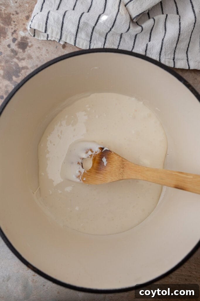 Mini marshmallows added to melted butter in a pot