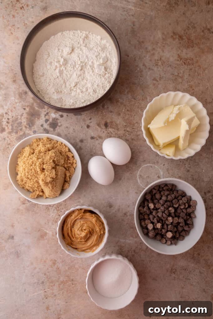 Ingredients for Peanut Butter Chocolate Chip Cookies laid out on a table