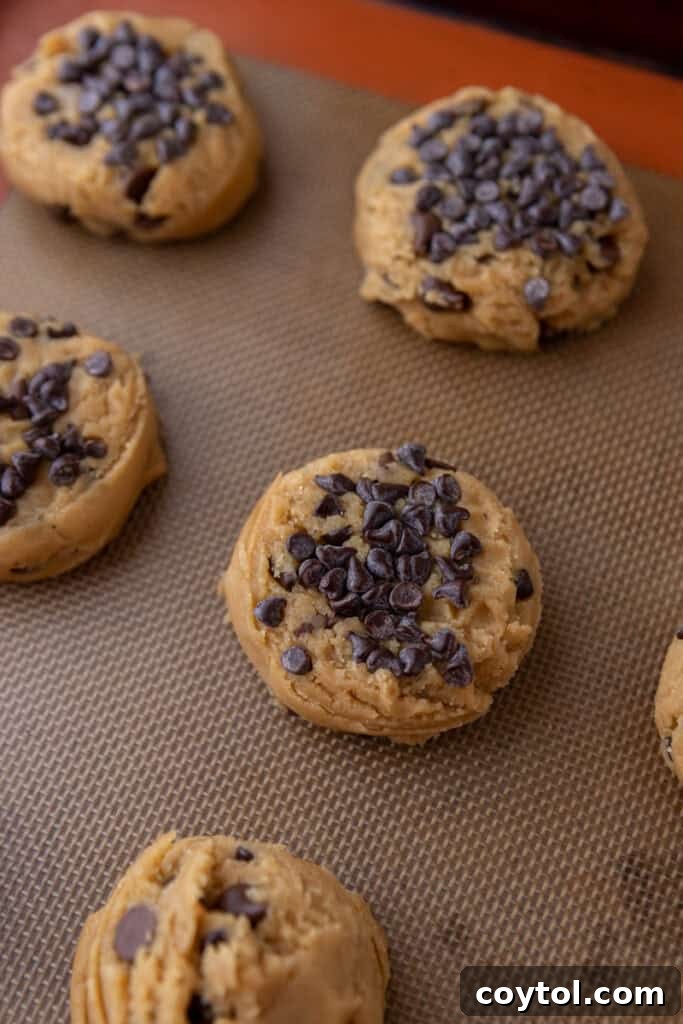 Baked Peanut Butter Chocolate Chip Cookies on a baking sheet