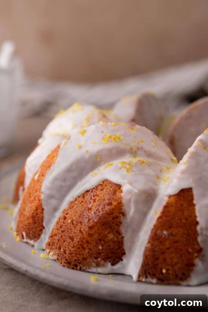 Zesty & Moist Lemon Bundt Perfection 15 Close-up of the elegant lemon glaze dripping down the sides of the bundt cake