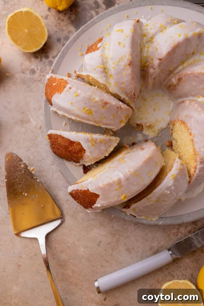 Zesty & Moist Lemon Bundt Perfection 19 An overhead shot of multiple slices of lemon bundt cake on a serving board, showcasing their perfect presentation.