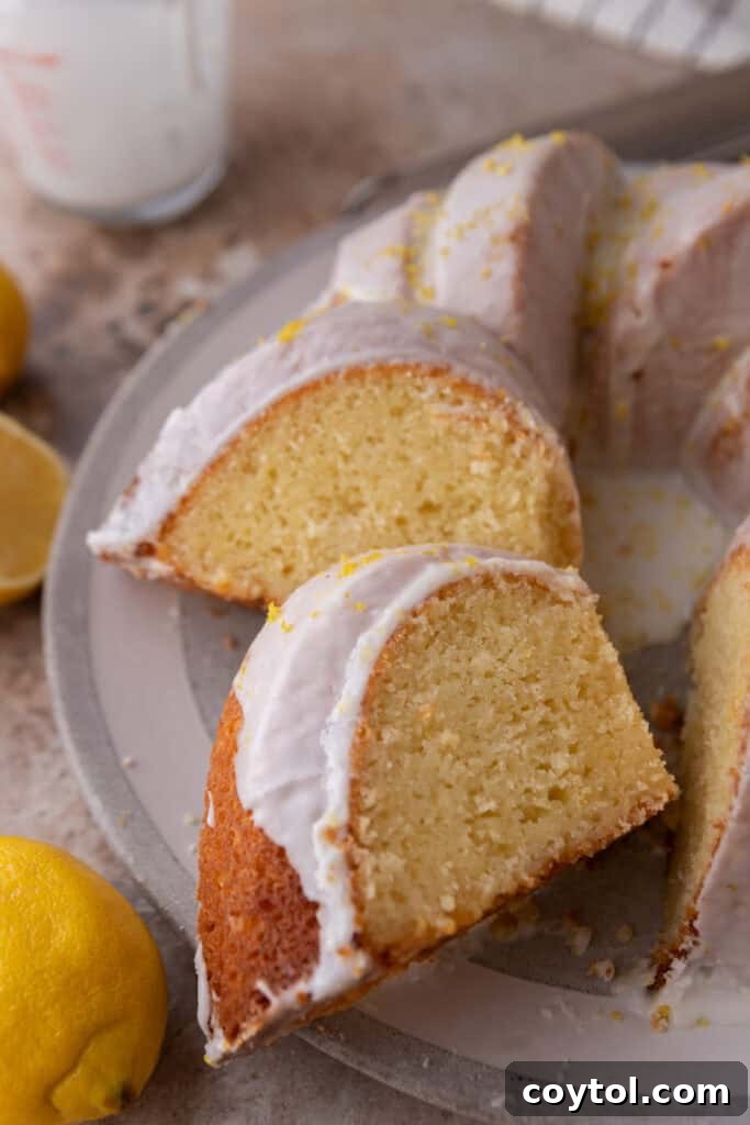 Zesty & Moist Lemon Bundt Perfection 4 Several slices of the finished moist lemon bundt cake artfully arranged, showing the perfect glaze and delicate texture.