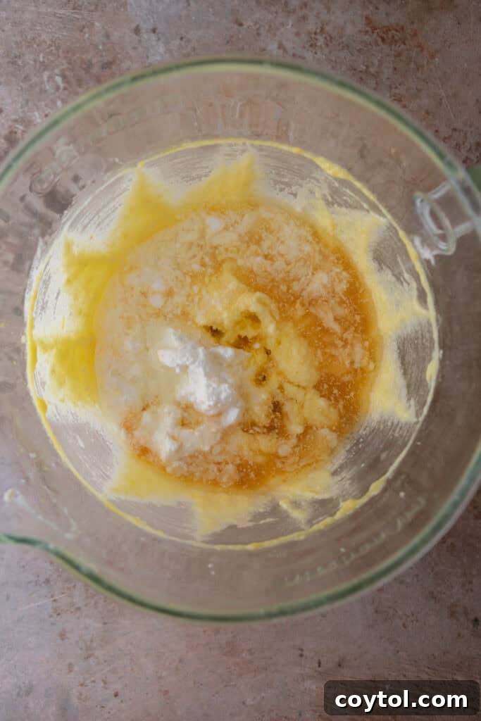 Zesty & Moist Lemon Bundt Perfection 8 Eggs being added one by one to the batter