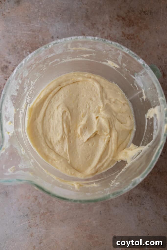 Zesty & Moist Lemon Bundt Perfection 9 Fully mixed cake batter in a bowl