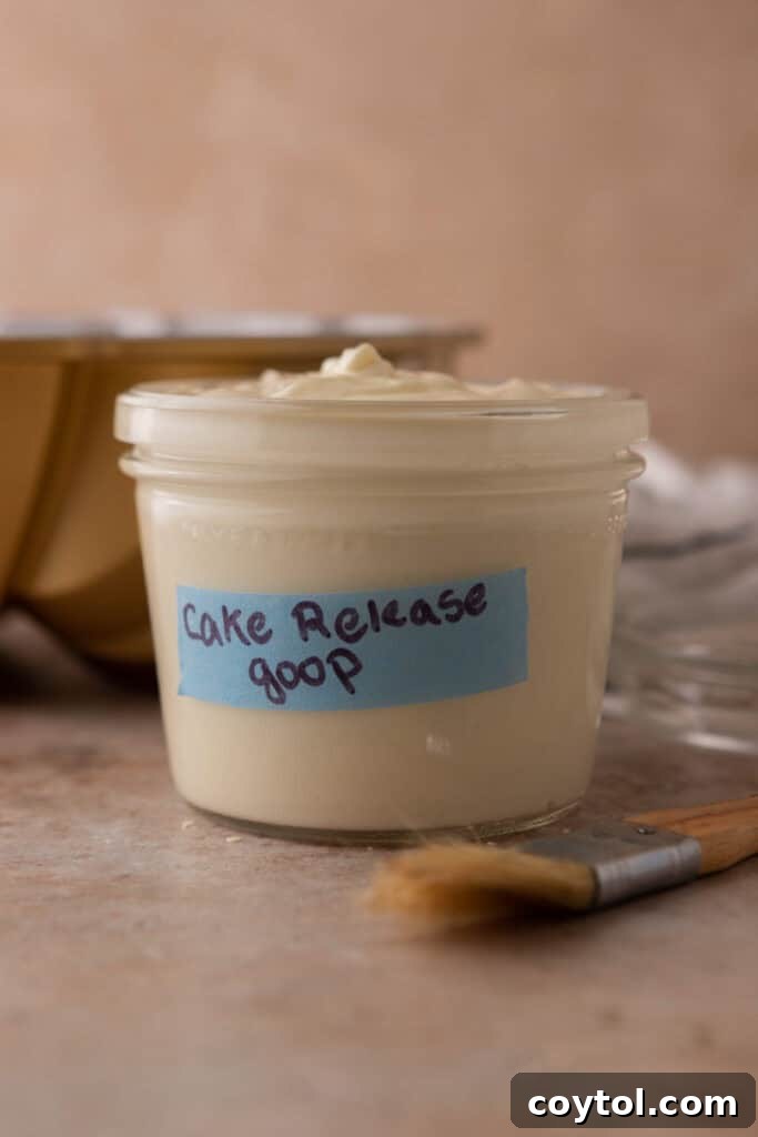 A side view of the homemade cake release mixture in a jar, showcasing its smooth texture