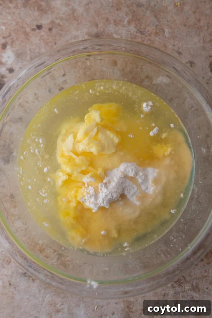 Unmixed flour, oil, and shortening in a bowl before combining