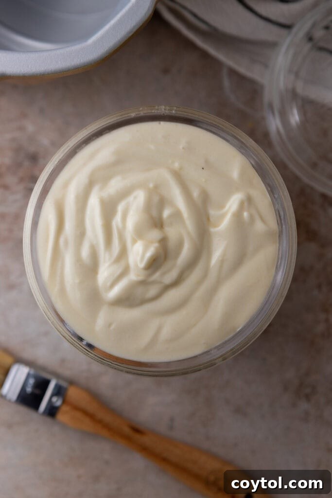 Homemade cake release in a jar with a pastry brush, ready for use