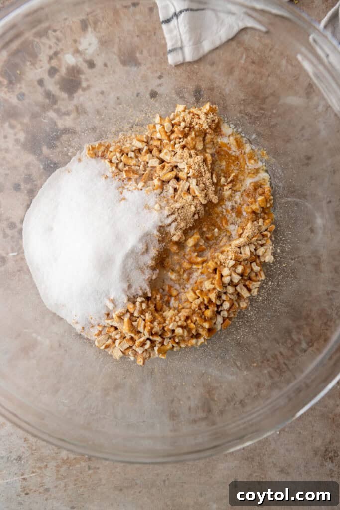 The Ultimate Salty Sweet Pretzel Pie Crust 6 Unmixed pretzel crumbs, sugar, and melted butter in a bowl before combining.