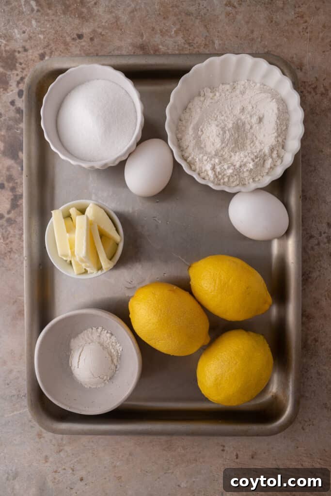 Close-up of small batch lemon bars, perfectly golden and dusted with powdered sugar.