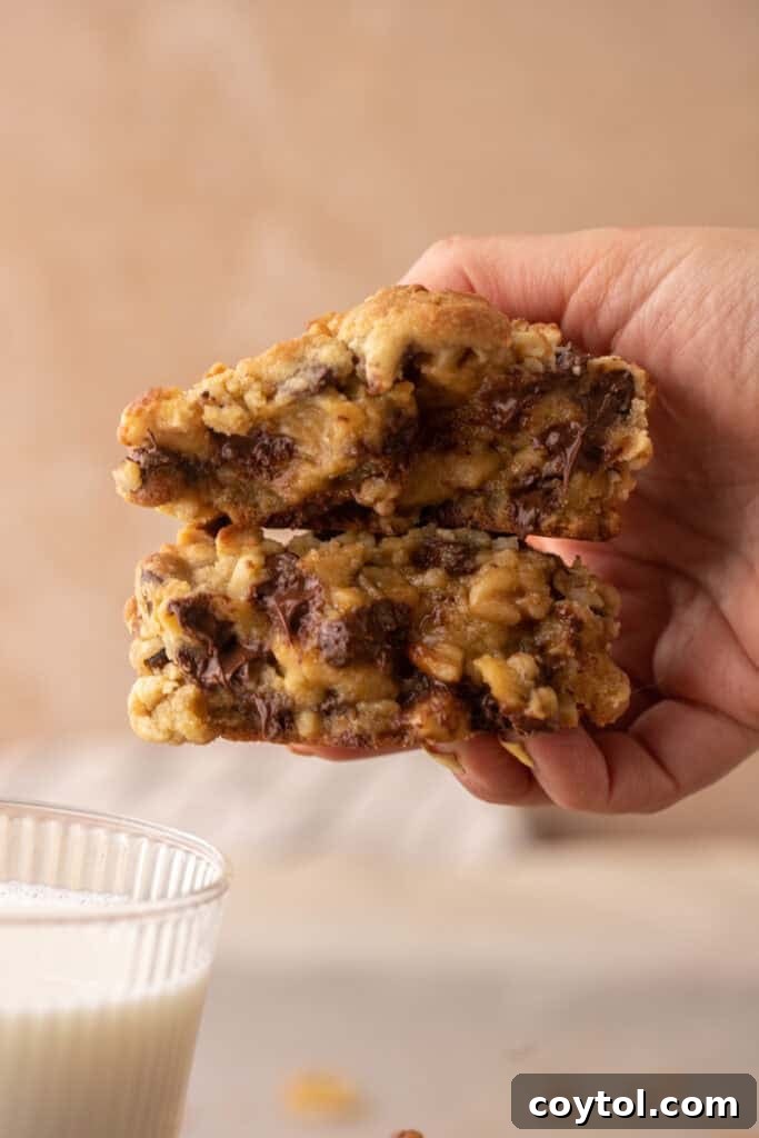 hand holding thick bakery style cookie