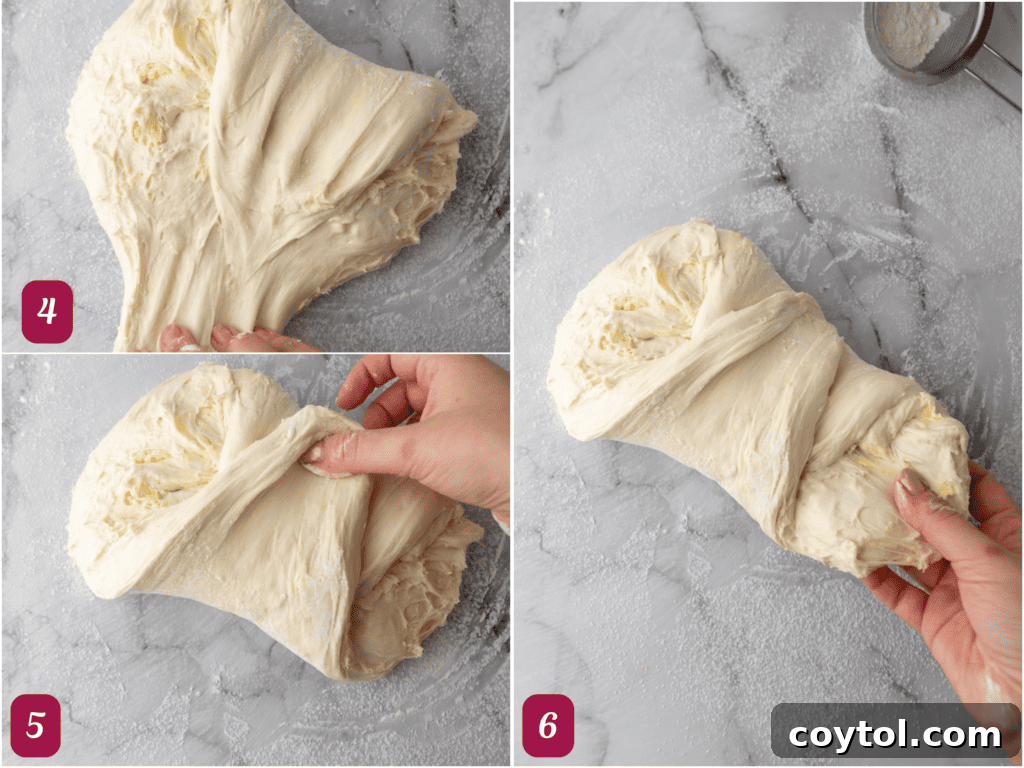 The sourdough dough rotated 90 degrees, with edges gently pulled and tucked underneath, beginning to form a round shape.