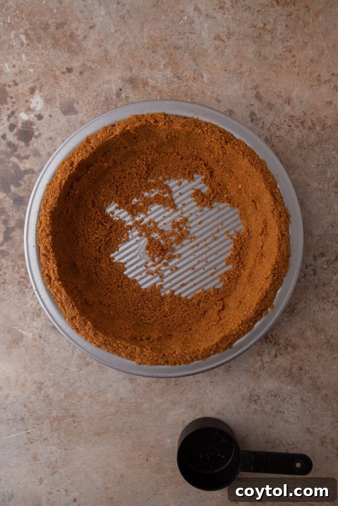 Unlock the Secret to the Perfect Biscoff Pie Crust 12 A Biscoff pie crust in a pie plate, freshly pressed and ready for either chilling or baking.