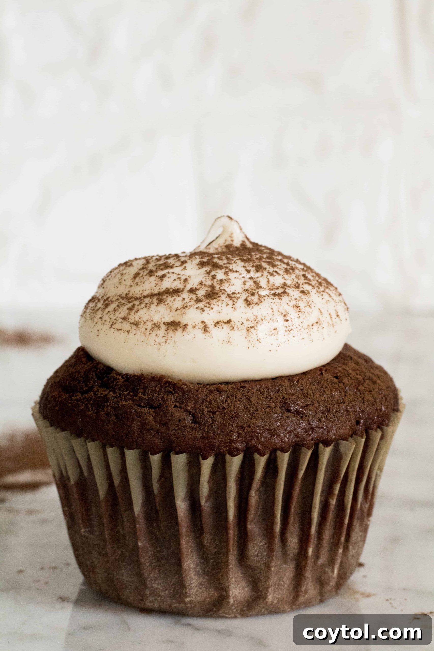 Assorted cupcakes with various buttercream frostings
