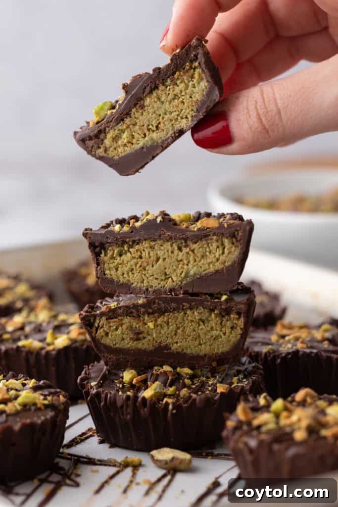 Dubai Chocolate Cups Recipe getting picked up by a hand