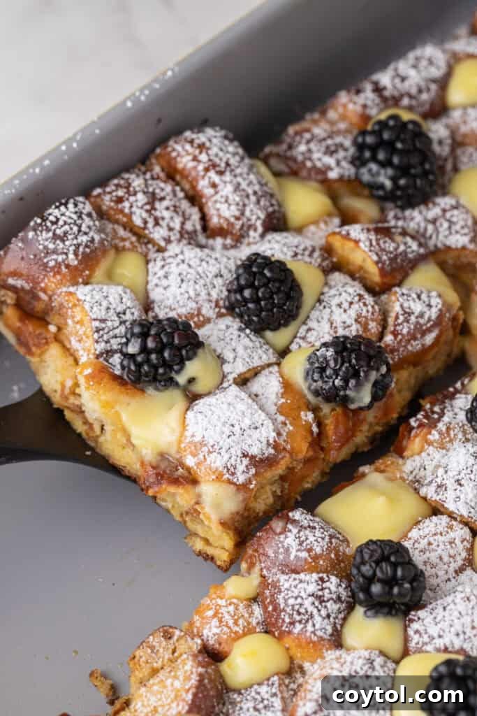 Pretzel Crusted French Toast Casserole 2 Pretzel French Toast Bake slice being scooped out of the pan