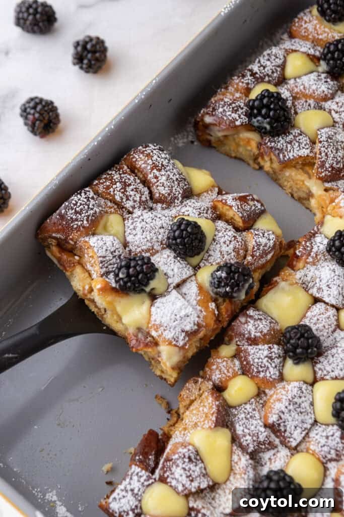 Pretzel Crusted French Toast Casserole 14 Pretzel French Toast Bake slice being scooped out of the pan