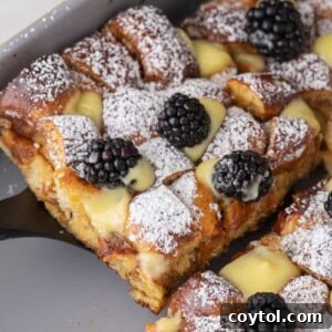 Pretzel Crusted French Toast Casserole 15 Pretzel French Toast Bake slice being scooped out of the pan