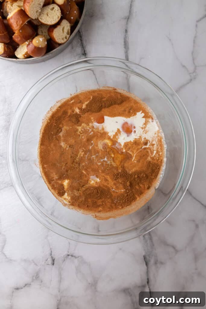 Pretzel Crusted French Toast Casserole 6 unmixed ingredients in a bowl