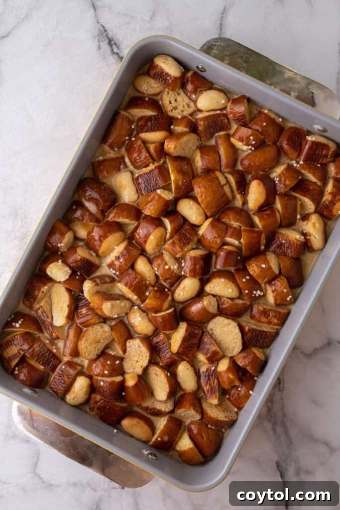 Pretzel Crusted French Toast Casserole 8 bread pieces with custard poured over it