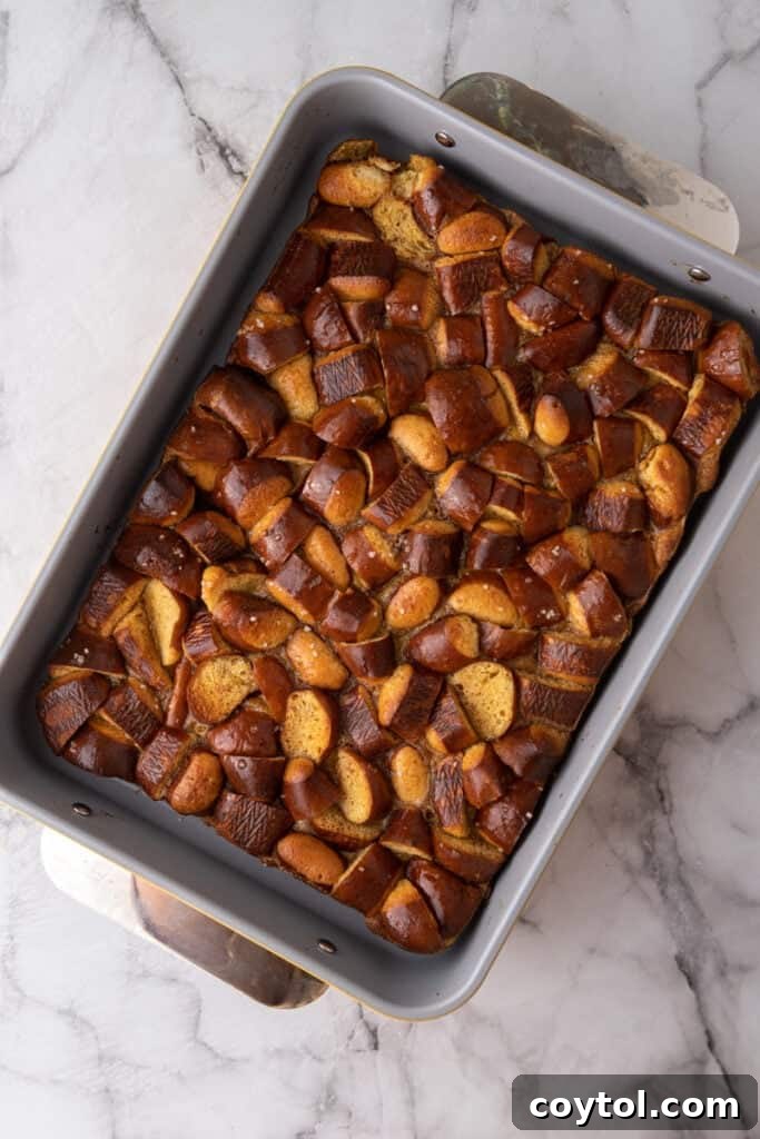 Pretzel Crusted French Toast Casserole 9 cooked bread pieces with custard poured over it