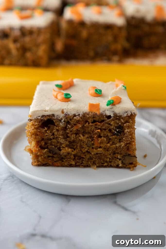 A second slice of Carrot Cake Sheet Cake on a plate, highlighting its soft interior