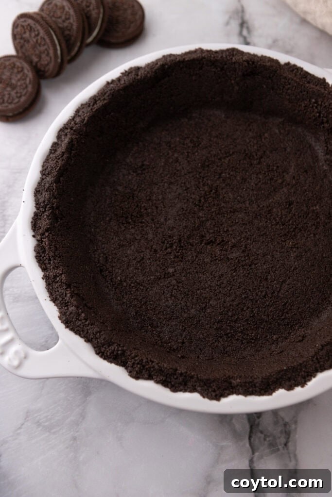 Oreo Pie Crust Recipe overhead shot with a golden spoon